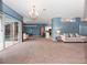 Open concept living room with kitchen and pool access at 103 Vega Ct, Davenport, FL 33896