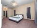 Large main bedroom with ensuite bathroom and ceiling fan at 103 Vega Ct, Davenport, FL 33896