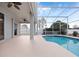 Large pool patio with access from sliding doors at 103 Vega Ct, Davenport, FL 33896