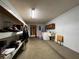 Unfinished basement with laundry hookups and shelving at 1085 Old Hickory Tree Rd, St Cloud, FL 34771