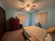 Bedroom with double bed, dresser, and window blinds at 1085 Old Hickory Tree Rd, St Cloud, FL 34771