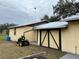 View of the home's exterior with a detached garage at 1085 Old Hickory Tree Rd, St Cloud, FL 34771