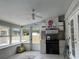 Florida room with a brick fireplace and built-in bar at 1085 Old Hickory Tree Rd, St Cloud, FL 34771