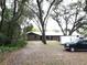 House with large trees and driveway at 1085 Old Hickory Tree Rd, St Cloud, FL 34771