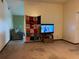 Living room with TV, sofa, and decorative tapestry at 1085 Old Hickory Tree Rd, St Cloud, FL 34771