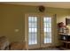 Living room with French doors that open to a screened porch at 1085 Old Hickory Tree Rd, St Cloud, FL 34771