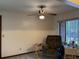 Living room with recliner and large window at 1085 Old Hickory Tree Rd, St Cloud, FL 34771
