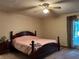 Spacious main bedroom with a king-size bed and access to the backyard at 1085 Old Hickory Tree Rd, St Cloud, FL 34771