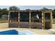 Tropical-themed pool bar with seating for four at 1085 Old Hickory Tree Rd, St Cloud, FL 34771