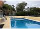 Rectangular swimming pool with surrounding patio at 1085 Old Hickory Tree Rd, St Cloud, FL 34771