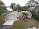 Aerial view of single-story home with lake access at 1186 Laguna Cir, St Cloud, FL 34771