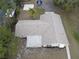Aerial view of a single-story home with a large backyard and water access at 1186 Laguna Cir, St Cloud, FL 34771