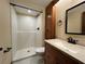 Bathroom with shower, vanity and wood cabinet at 1186 Laguna Cir, St Cloud, FL 34771