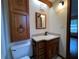 Bathroom with vanity, toilet and wood cabinet at 1186 Laguna Cir, St Cloud, FL 34771