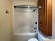 Bathroom with shower/tub combo and wood cabinet at 1186 Laguna Cir, St Cloud, FL 34771