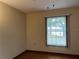 Bedroom with water view and wood flooring at 1186 Laguna Cir, St Cloud, FL 34771