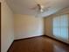 Spacious bedroom with wood floors and ceiling fan at 1186 Laguna Cir, St Cloud, FL 34771