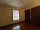 Bedroom with wood floors and window coverings at 1186 Laguna Cir, St Cloud, FL 34771