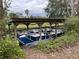 Covered boat lift with pontoon boat at 1186 Laguna Cir, St Cloud, FL 34771