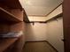 Walk-in closet with shelving and hanging rod at 1186 Laguna Cir, St Cloud, FL 34771