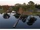 Wooden dock extending over calm lake water at 1186 Laguna Cir, St Cloud, FL 34771