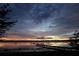 Beautiful sunset view over calm lake waters at 1186 Laguna Cir, St Cloud, FL 34771