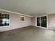 Peaceful patio with lake views and sliding glass doors at 1186 Laguna Cir, St Cloud, FL 34771