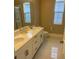 Double vanity bathroom with modern finishes at 14429 Wabasso Loop, Winter Garden, FL 34787