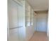 Bright walk-in closet with custom shelving and rods at 14429 Wabasso Loop, Winter Garden, FL 34787