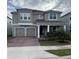 Two-story house with a two-car garage and landscaped front yard at 14429 Wabasso Loop, Winter Garden, FL 34787