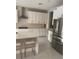Modern kitchen with stainless steel appliances and white cabinets at 14429 Wabasso Loop, Winter Garden, FL 34787