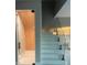Modern staircase with glass railing and wine cellar at 14429 Wabasso Loop, Winter Garden, FL 34787