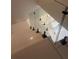 Modern staircase with glass railings and white risers at 14429 Wabasso Loop, Winter Garden, FL 34787