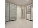 Bright walk-in closet featuring built-in shelving and mirror at 14429 Wabasso Loop, Winter Garden, FL 34787