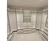 Large walk-in closet with custom shelving and drawers at 14429 Wabasso Loop, Winter Garden, FL 34787