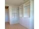 Large walk-in closet with custom shelving and drawers at 14429 Wabasso Loop, Winter Garden, FL 34787