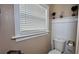 Small half bathroom with toilet and pedestal sink at 14636 Bray Rd, Orlando, FL 32832