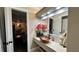 Bathroom with copper sink, view of kitchen, and updated fixtures at 14636 Bray Rd, Orlando, FL 32832