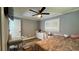Bedroom with a double bed, desk area, and ceiling fan at 14636 Bray Rd, Orlando, FL 32832