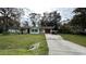 Front yard view of house and boat at 14636 Bray Rd, Orlando, FL 32832