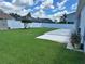Large backyard with patio and grassy area at 148 Joewood Trl, Davenport, FL 33837