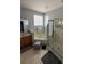 Main bathroom with corner tub and walk-in shower at 148 Joewood Trl, Davenport, FL 33837