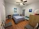 Bedroom with a queen bed and light wood floors at 148 Joewood Trl, Davenport, FL 33837