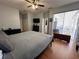 Large bedroom with king bed, access to patio and additional closets at 148 Joewood Trl, Davenport, FL 33837