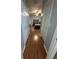 Long hallway with light wood laminate flooring at 148 Joewood Trl, Davenport, FL 33837