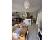 Open kitchen with breakfast bar and view into living room at 148 Joewood Trl, Davenport, FL 33837