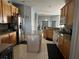 Modern kitchen featuring wood cabinets and an island at 148 Joewood Trl, Davenport, FL 33837