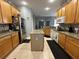 Large kitchen with granite countertops and island at 148 Joewood Trl, Davenport, FL 33837