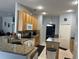 Bright kitchen with granite countertops and ample cabinetry at 148 Joewood Trl, Davenport, FL 33837