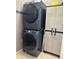 Stackable Samsung washer and dryer in laundry room at 148 Joewood Trl, Davenport, FL 33837